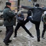 Anti-gay attacker kicks LGBTI rights protester in Voronezh, southwest Russia, on Jan. 20. (Photo courtesy of Article20.org)