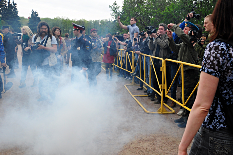 Anti-gay protesters threw smoke pellets, insults and small rocks at the LGBT rights demonstrators. (Photo by Olga W)