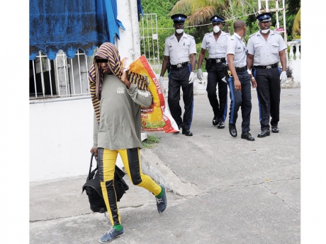 Police evicted gay men from abandoned house in Millborough. (Photo courtesy of Jamaica Gleaner)