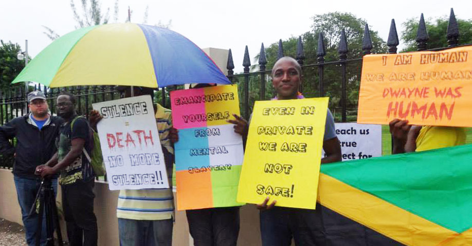 Maurice-Tomlinson-and-LGBT-protesters-stand-09-2013