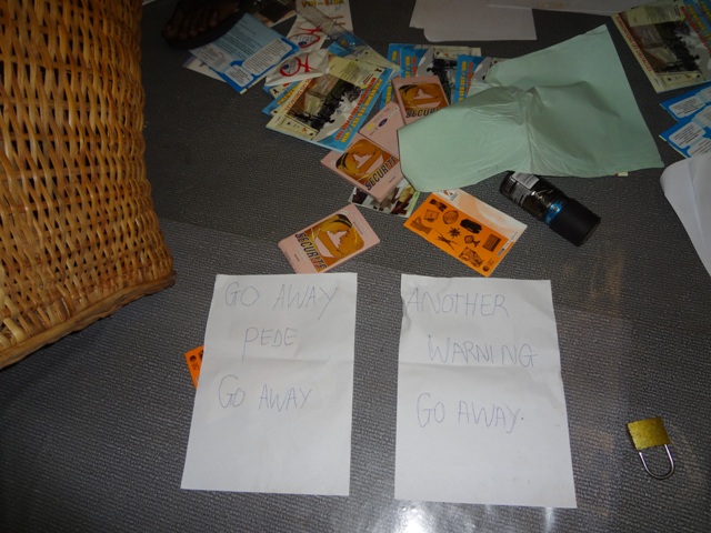 Vandals who burglarized CAMEF office left behind these threatening messages. (Photo by a neighbor, provided by CAMEF.)