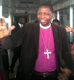 Archbishop Stanley Ntagali greets at Entebbe Airport on his return from England on Jan. 16. (Photo courtesy of the Church of Uganda)