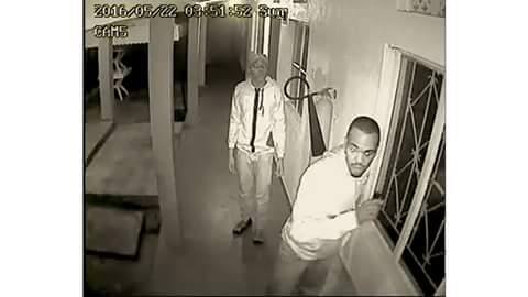 A security camera captured this photo of two of the four burglars who break into the offices of HRAPF on May 22 and killed a security guard.