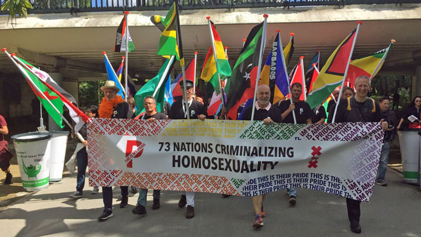 Protesters at Pride Walk carried flags of 73 nations with anti-homosexuality laws. The Erasing 76 Crimes blog helped to identify those countries and gay-rights activists who deserved recognition for their work there. (Photo courtesy of Pride Walk)