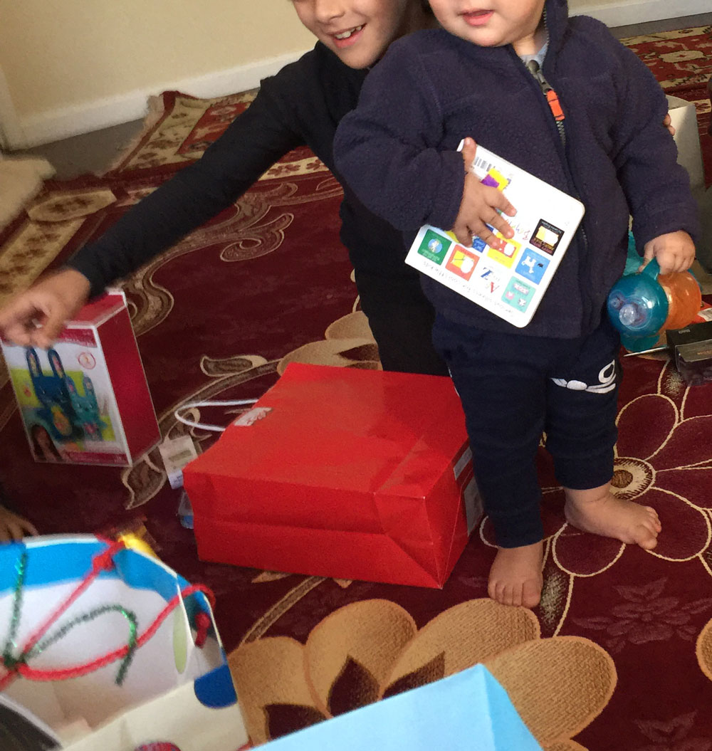 Afghan children in San Diego welcomed the visit from Baba Noel. (Photo courtesy of Linda Miles)