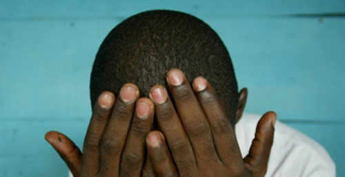 Hiding the face of HIV in Africa. (Photo courtesy of Getty Images)
