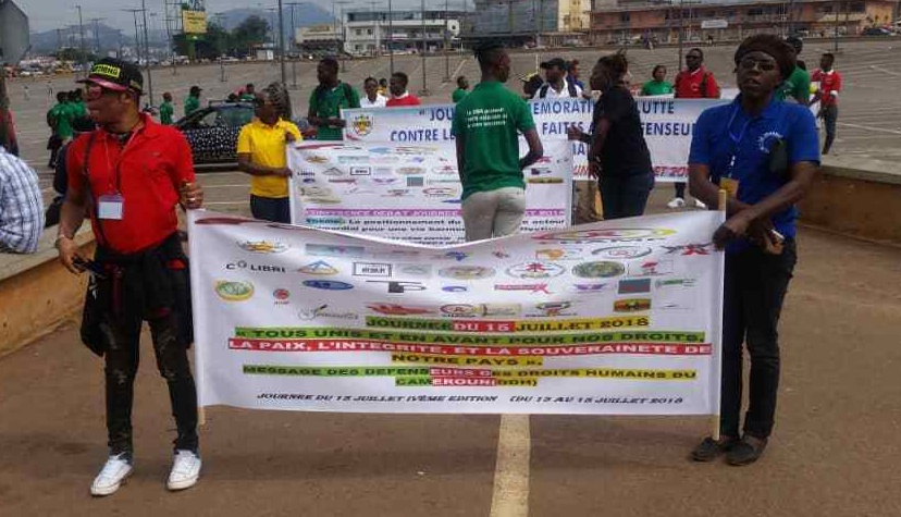 Marchers in Yaoundé, Cameroon, celebrate the Day of Remembrance of the Fight Against Violence Targeting Human Rights Defenders. (Photo courtesy of Steeves Winner)
