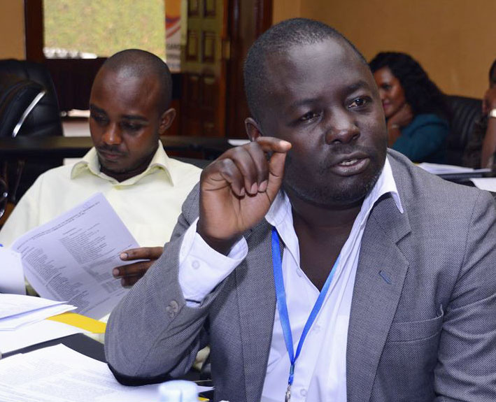 Kikonyogo Kivumbi (right) at his first meeting the Country Coordinating Mechanism board in 2015, where he represented LGBTI people, men who have sex with men (MSM), sex workers and intravenous drug users. At left is his elected alternate, Jude Ayebare.