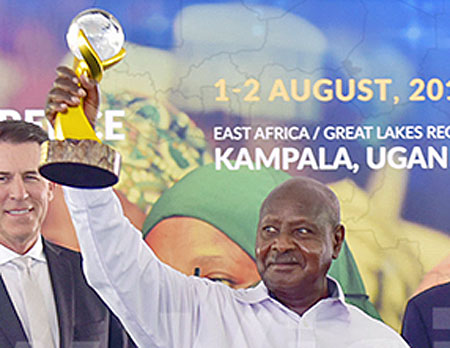 Ugandan President Yoweri Museveni displays the peace prize trophy that he won. (Maria Wamala photo courtesy of New Vision)
