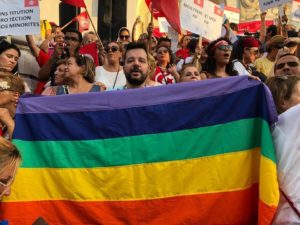 Shams President Mounir Baatour holds a rainbow banner during an August 2018 demonstration in Tunis for equality and individual liberties. (Photo courtesy of Mounir Baatour)