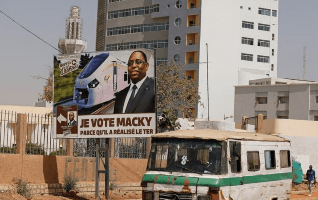 Campaign poster for the upcoming presidential election shows Senegal's president Macky Sall and with the endorsement that means "I vote Macky Sall because he brought about the TER (the Regional Express Train)" in Dakar, Senegal. (Zohra Bensemra photo courtesy of Reuters)