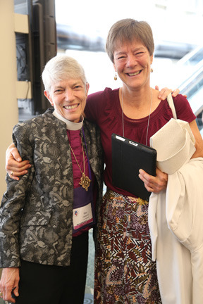 Bishop Mary Glasspool (left) and her spouse, Becki Sander, in 2015. (Photo courtesy of Episcopal News)