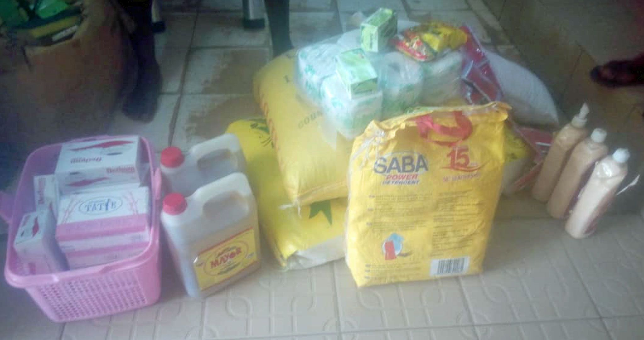 Generous donors paid for this supplementary food and hygiene items which will have to last for two months for three gay prisoners in Cameroon: rice, detergent, pasta, packets of peanuts, cooking oil, sugar, anti-septic soap, bags of tomatoes, tapioca, bleach, shrimp flavor cubes, salt and toilet paper. (Photo by AJFG)