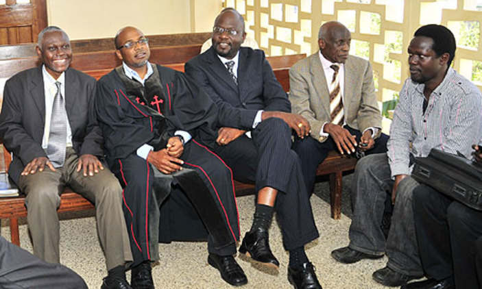 Convicted: defendants, pastors Solomon Male, Martin Sempa, Michael Kyazze and their aides at Buganda Road court during the trial that ended in their conviction. 