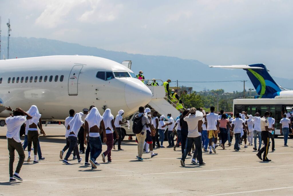 Haitian deportees prepare to leave the airport in Port-au-Prince, Haiti, on Sept. 21 after being flown there by U.S. authorities from Del Rio, Texas, where the would-be migrants sought asylum. (Ralph Tedy Erol photo courtesy of Reuters)