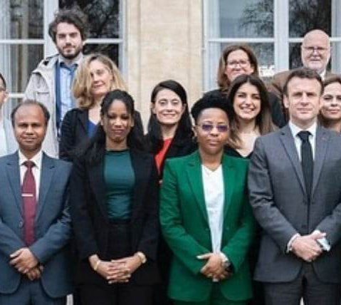 Bangladesh activist Shahanur Islam (left), French president Emmanuel Macron (right) and other activists at March 17 reception. (Photo courtesy of JusticeMakers Bangladesh)