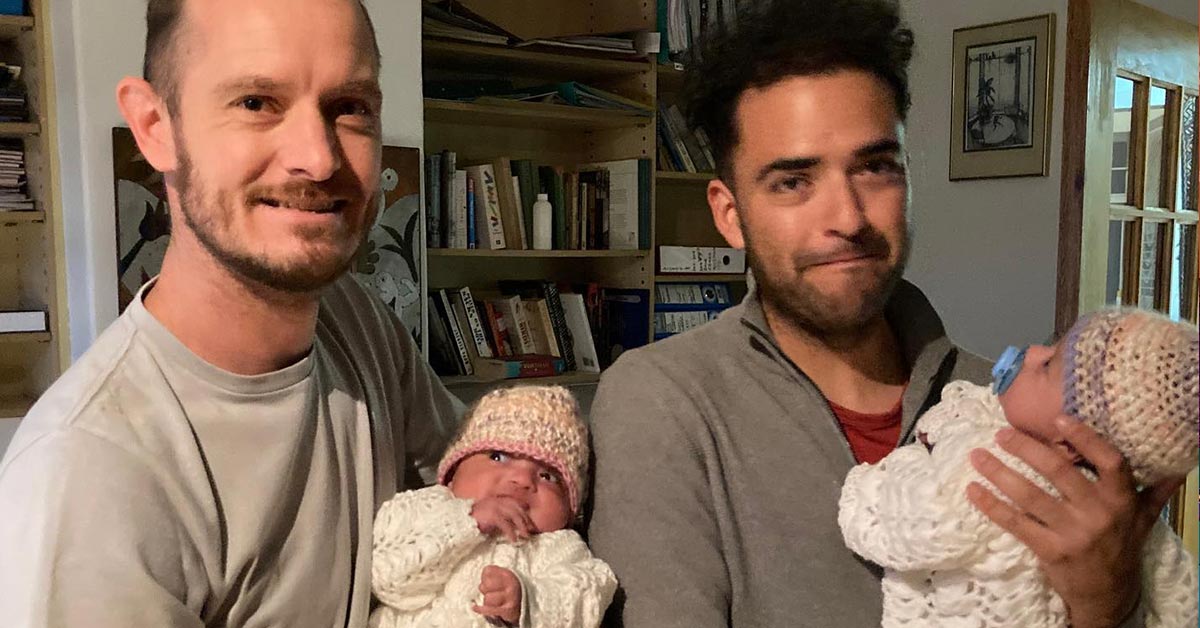 Phillip Lühl and Guillermo Delgado with their twin sons, Paula and Maya. (Photo courtesy of Mamba Online)