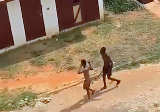 Young man runs from attacker at University of Ghana. (Screen shot from widely distributed online video)