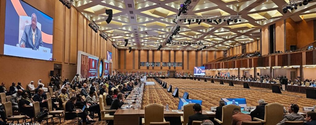 Uganda President, Yoweri Museveni on screen addresses the summit in Kampala. Photo Courtesy of Uganda Ministry of Foreign Affairs