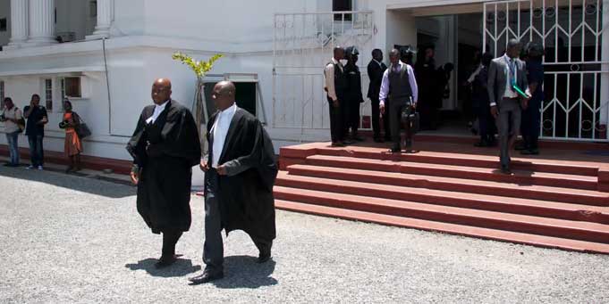 Attorneys walk in front of Ghana's Supreme Court (ttorneys leaving Ghana’s Supreme Court. (Chris Stein photo courtesy of AFP and The Africa Report)