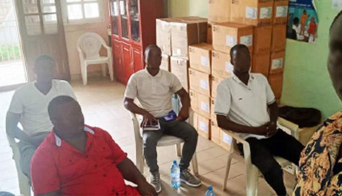 Reporter/activist Steeves Winner (pseudonym) meets with the four gay ex-prisoners in Ebolowa. Their faces are blurred for their safety. (Photo by Steeves Winner)