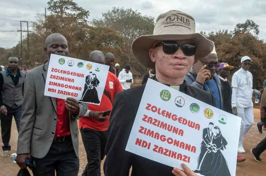 Religious leaders carry anti-LGBTQ signs during July 2023 march against same-sex marriage in Malawi. (Photo courtesy of VOA)