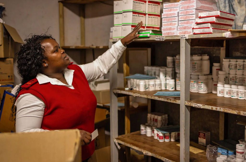 A nurse in the dispensary of a clinic in Mhlosheni, Eswatini, which once had the world’s highest rate of H.I.V. infection. From January to April, nearly 5,000 people with H.I.V. failed to pick up their medication, most likely because their clinics were closed or their outreach workers were fired. (Gulshan Khan photo courtesy of The New York Times)