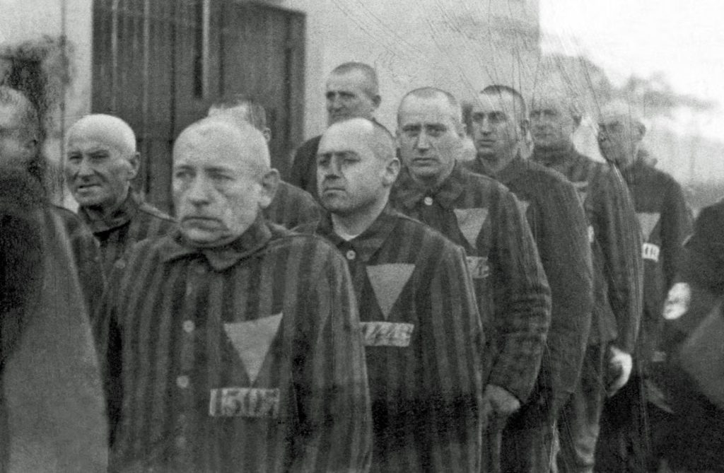 Homosexual prisoners wear pink triangles in a German concentration camp in 1939. (Photo courtesy of Getty Images)
