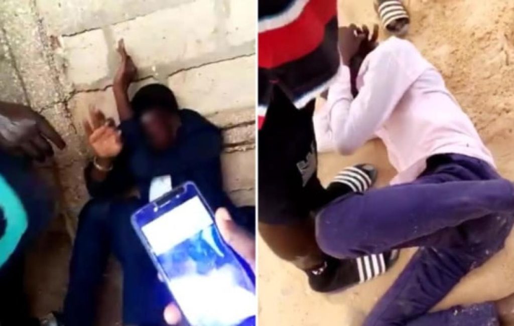 Men sprawled on the floor during an anti-gay police raid Sunday in Senegal. (Photos courtesy of Seneweb)