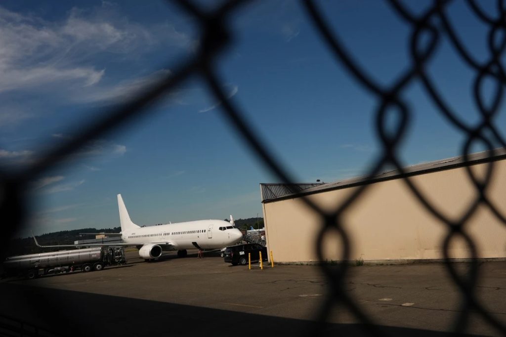 A U.S Immigration and Customs Enforcement flight operates out of a Seattle airport in August 2025. (Lindsey Wasson photo courtesy of AP)