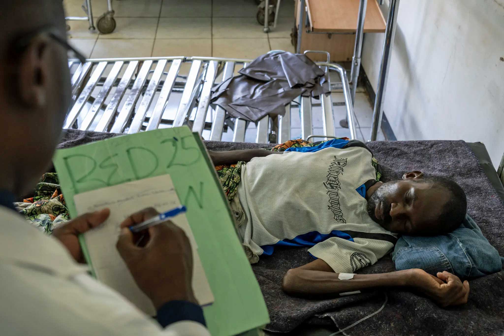 Lewis Chifuta, a patient with advanced H.I.V. disease, in the men’s ward at the Mpongwe mission hospital in northern Zambia. (Photo courtesy of The New York Times)