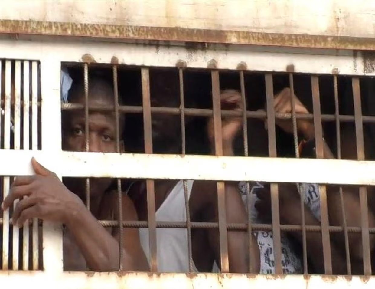 Prisoners in a truck on its way to deliver them to Kondengui Central Prison in Yaoundé, Cameroon. (Photo courtesy of The Guardian / Maidun Collection / Alamy)