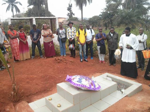 Mourners visit the grave of Eric Ohena Lembembe.