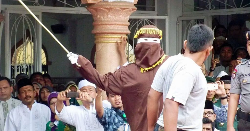 A caning in Indonesia, in the city of Banda Aceh, where same-sex intimacy is illegal under local Sharia law (Photo courtesy of Voice of America / Creative Commons)