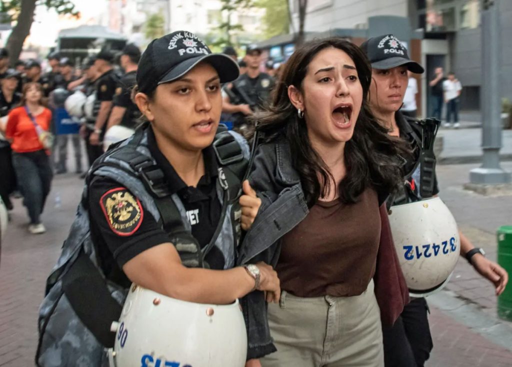 Turkish police arrest LGBT rights protesters opposed to this month's crackdown. (Photo courtesy of Getty / BBC)