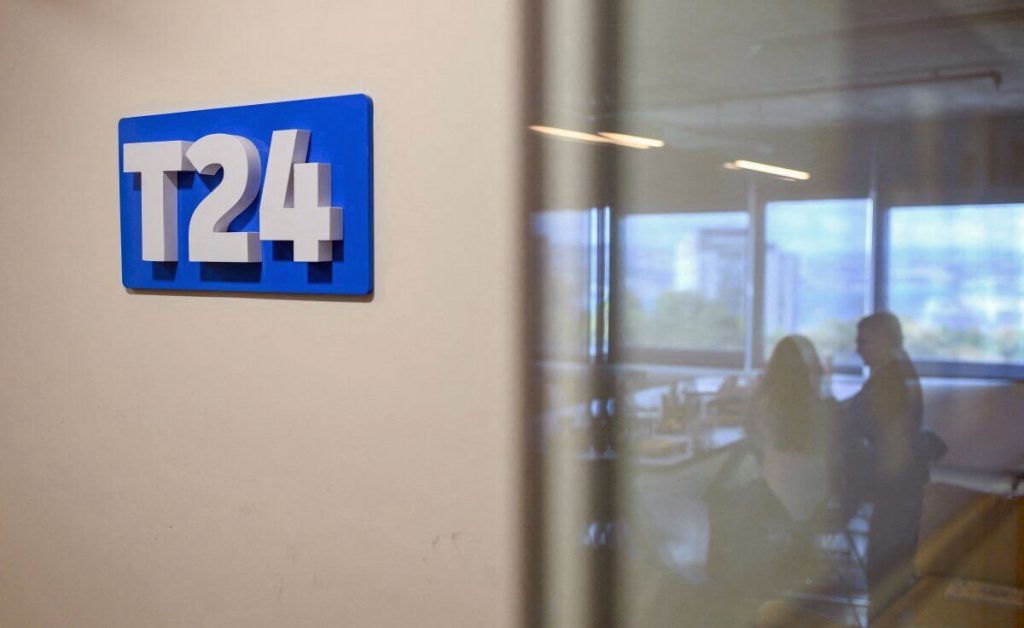 The T24 logo is pictured at the independent news website’s Istanbul studio during an interview on Oct. 1, 2026, a day after Turkiye shut down its website and social media accounts, citing “LGBT propaganda.” (Yasin Akgul photo courtesy of AFP / Turkish Minute)